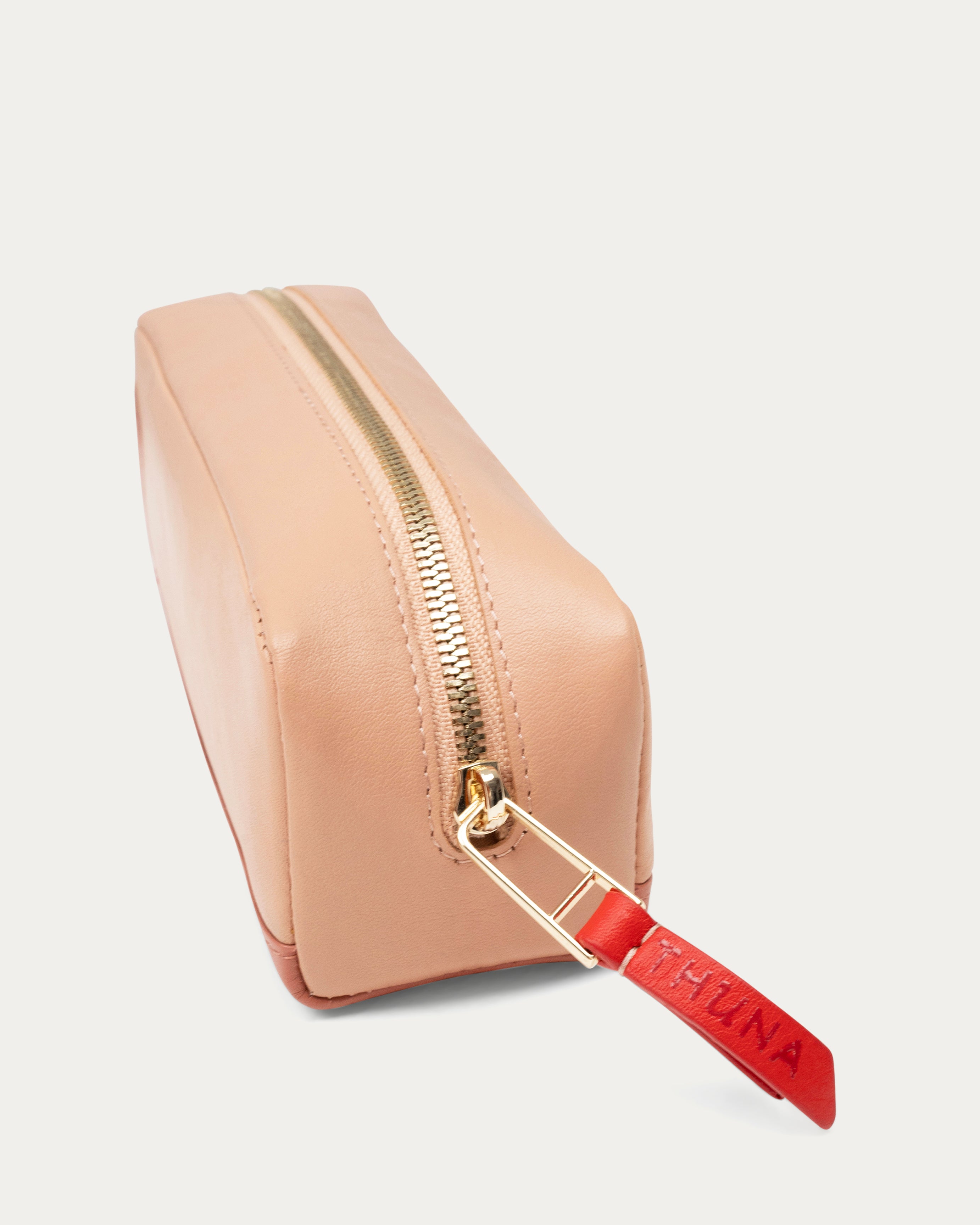 Two-tone beige and pink pouch with a red zipper on a white background - Kuwait BAGS - KSA bags