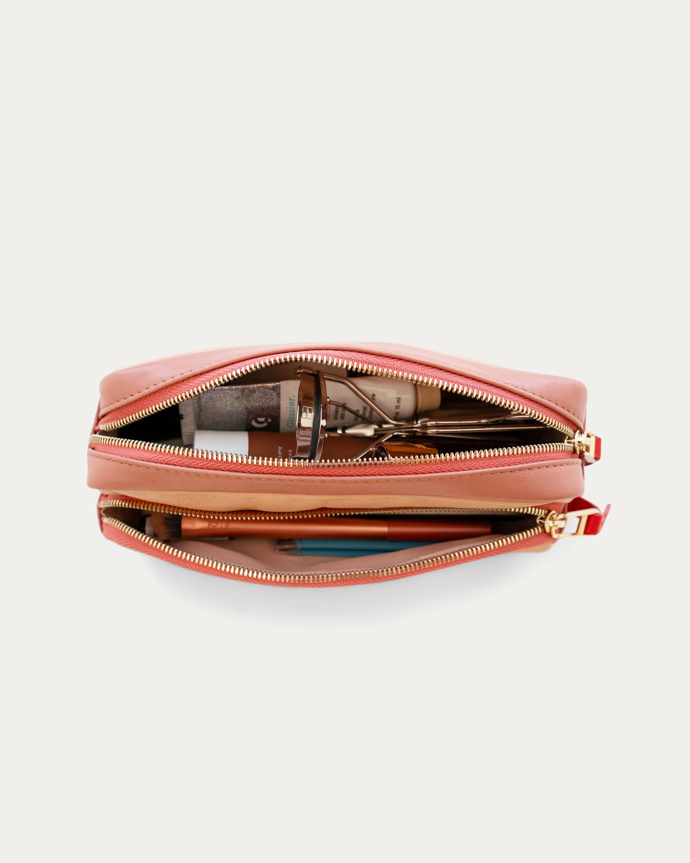 Beige and red rectangular pouch with 'Elevate your everyday' text on a light gray background - Kuwait bags - KSA Bags