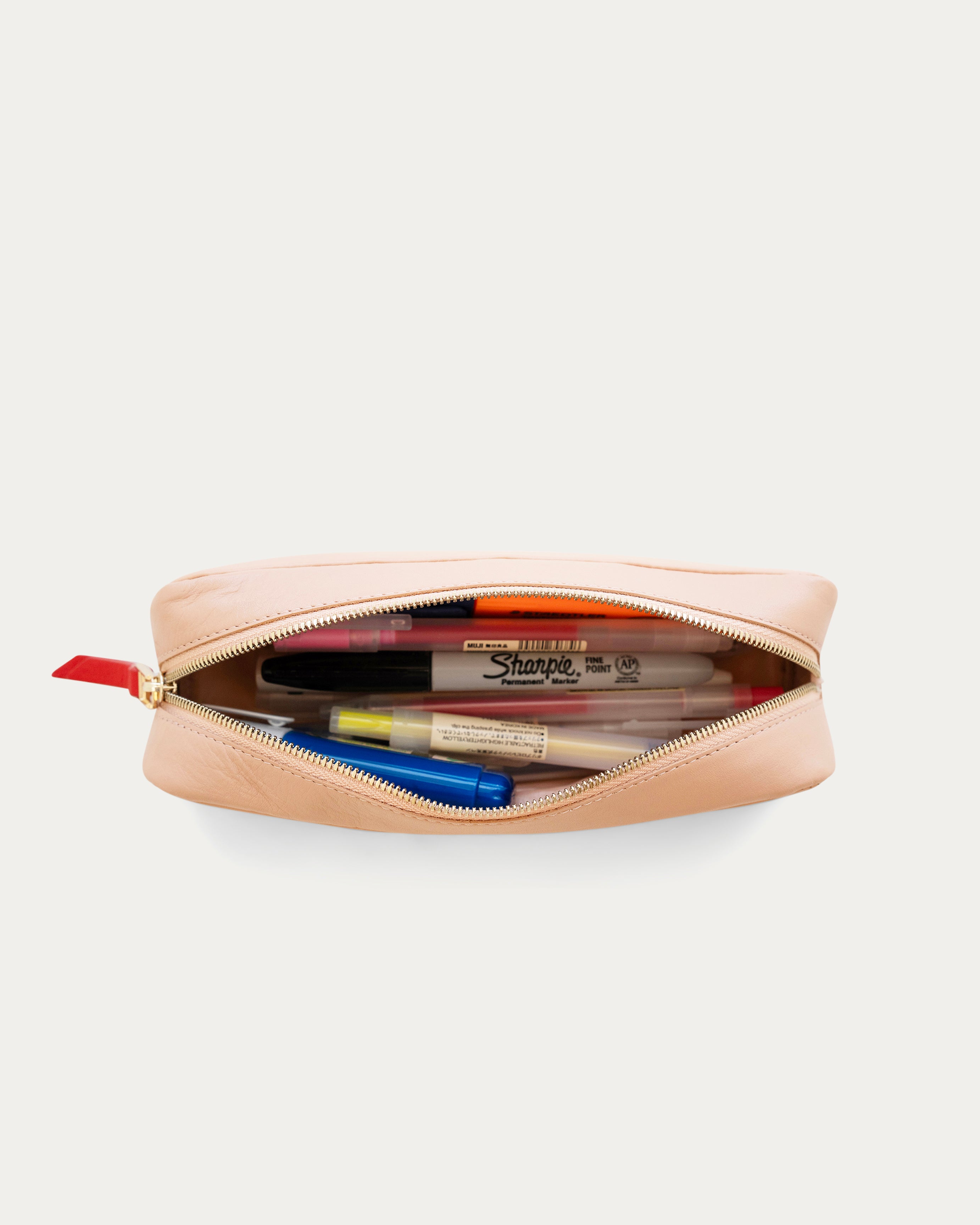 Two-tone beige and pink pouch with a red zipper on a white background - Kuwait BAGS - KSA bags