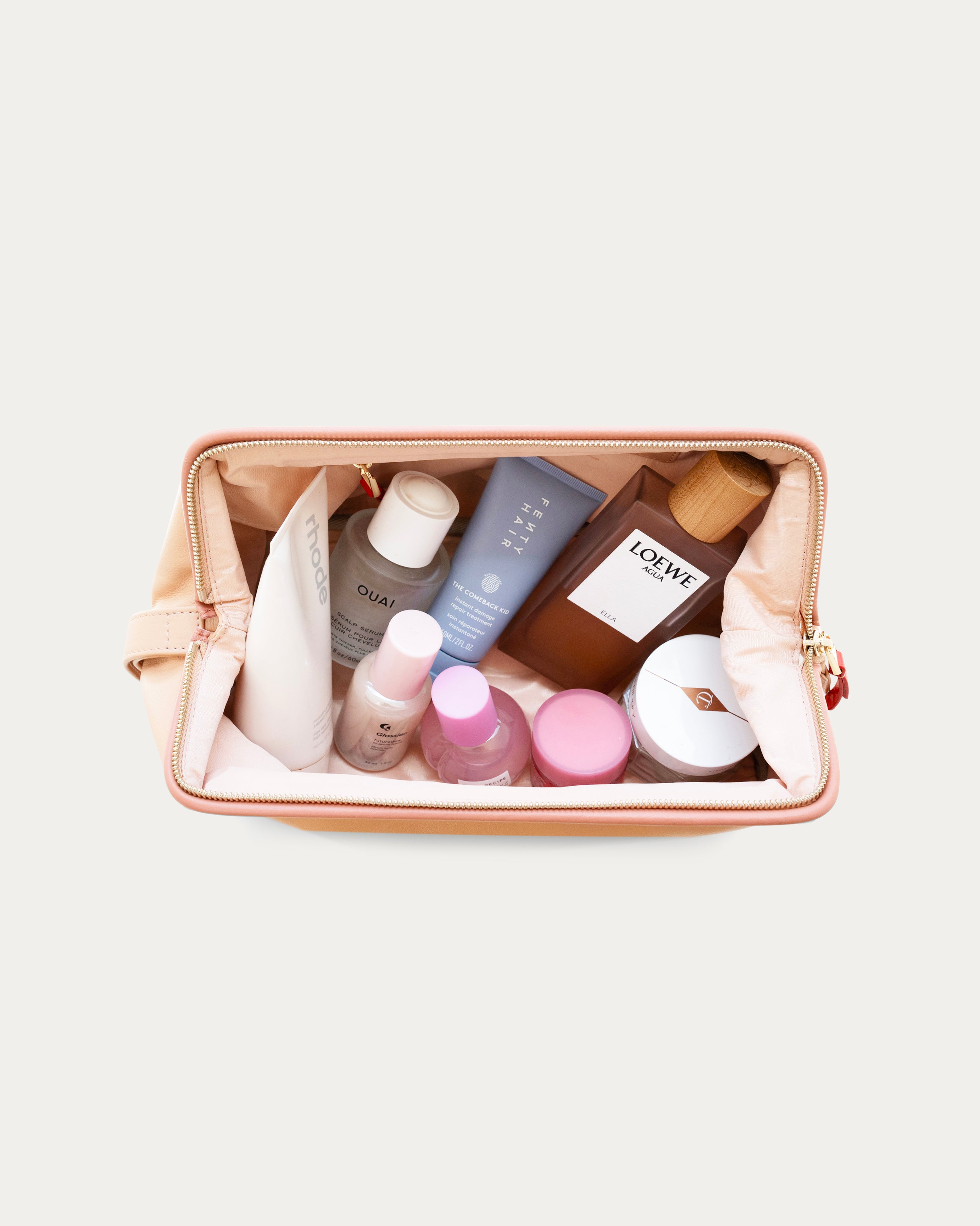 Beige makeup bag with gold zipper on a light gray background - Kuwait bags - KSA