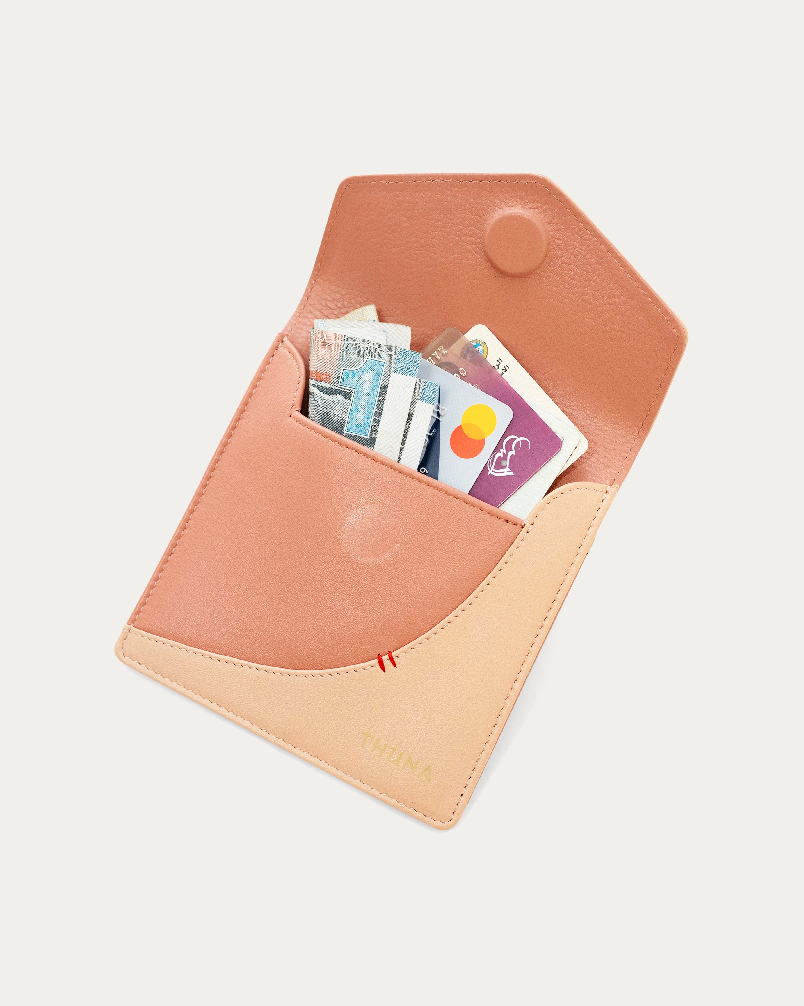 Small peach-colored envelope-style pouch - Kuwait bags - KSA