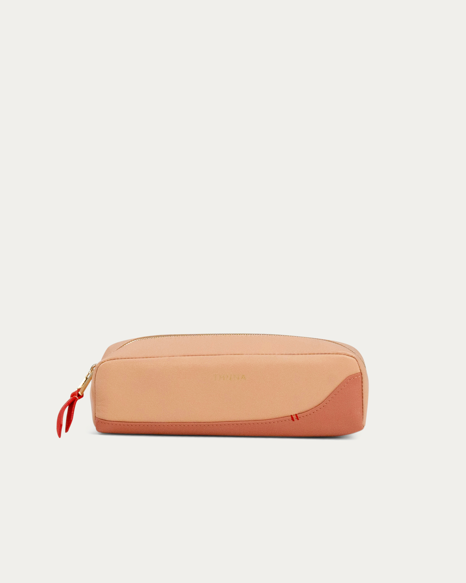 Two-tone beige and pink pouch with a red zipper on a white background - Kuwait BAGS - KSA bags 